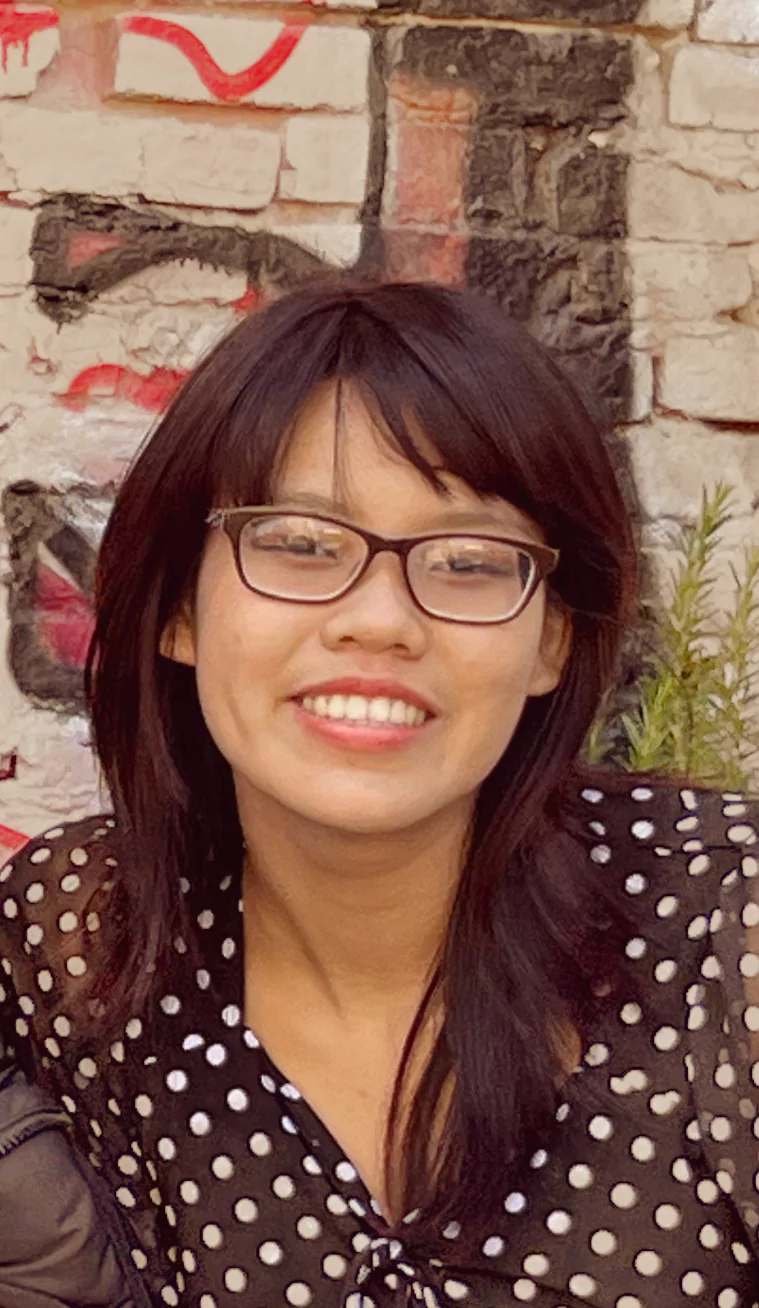 Photograph of Catherine Luong. She
      is smiling at the camera.